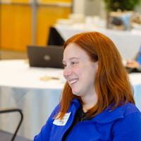 woman smiling during luncheon